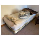 Two twin sized beds with twin bedding
