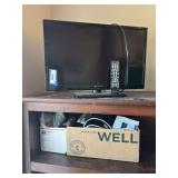 Element brand flatscreen TV and two boxes of various electronics and cords