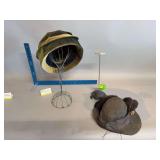 Two hat stands and ladies hats