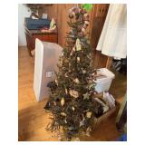Approx 4’ tall predecorated and prelit Christmas tree