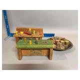 Two Playskool wooden hammer toys and alphabet blocks