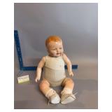 Baby doll w tin head and sleep eyes