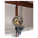 Cast iron wall bracket with oil lamp with Aladdin lock on chimney with Aladdin burner