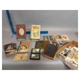 Box of vintage books and postcards