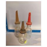 Three glass oil bottles w spouts