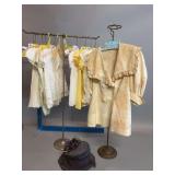 Group of vintage children’s linens with stands