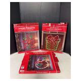 Lighted present, poinsettia and snowman