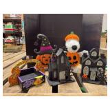 Halloween decor includes tinsel Snoopy, light up houses, treat tray and metal pumpkin