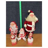 Four vintage Santas and one elf