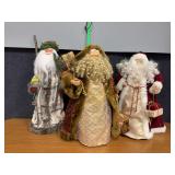 Three tall Santas