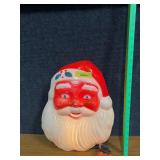 Approx 16x12 hard plastic light up Santa, does have crack at bottom of beard