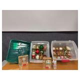 Two holiday ornament cases with ornaments