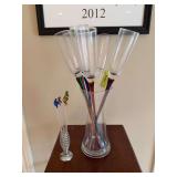 Colored glass champagne flutes and glass swizzle sticks