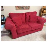 Red Sofa Express loveseat 72" shows wear
