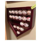 Baseball collection in home plate shaped wall case