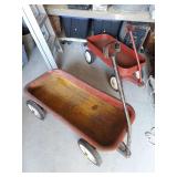 Two red coaster wagons