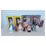 Dolls (some in boxes), accessories, doll-sized rocking horse, rocker crib cradle bed, tea playset