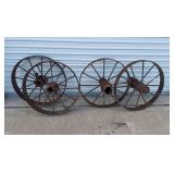 Set of (4) 27" steel wagon wheels (garden decoration, landscape wagon build). Left set(2): 27"dia, 4" tread width. Right set(2): 27"dia, 3" tread width. All are in standard antique condition, rust pat
