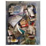 Upright ashtray and matchbooks