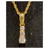 Women’s 18” chain marked 14K XL, pendant marked 14K HDS with graduating diamond trio pendant