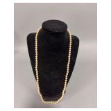Pearl? necklace, overall length 24”, unmarked, knotting between baubles