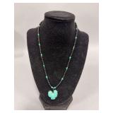 Turquoise chicken pendant , black beaded 17” necklace