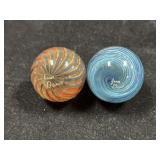 Two glass orbs, both engraved ???