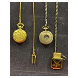 Two pocket watches and a money clip