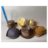 Five hats and hat holder