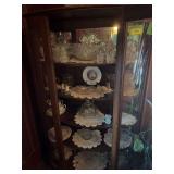 Contents of curio cabinet include various pieces clear glass, wheel etched stemware, etc
