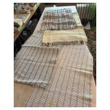 Four woven rugs