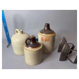Three stoneware jugs and two No.8 sad irons