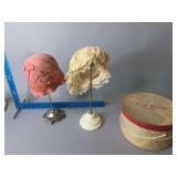 Two hat stands w hats and New Utica Des Moines hat box