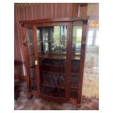16D x 45.5L x 65H mahogany curved glass front and glass sides single door curio cabinet on wheels with mirrored back