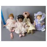 Three bisque dolls and one composition with sleep eyes