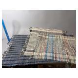 Three woven rugs
