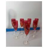 Eight cranberry wheel etched wine glasses