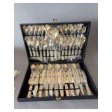 Flatware set, appears complete, light gold color