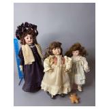 Three bisque dolls