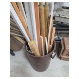 Trash can with contents (wood pieces)