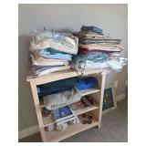 Placemats, queen sheets, chicken decorations (contents of shelf-bring boxes to pack)