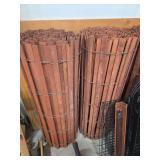 Two rolls of wooden snow fence