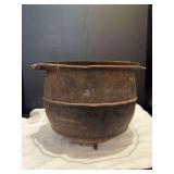 Three footed cast iron cauldron