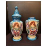 Two hand painted covered urns approx 18” tall, one is missing lid