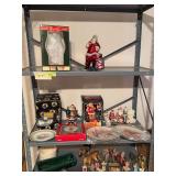 Christmas decor includes nativity scene marked W Germany, Hummel plate, garland, Santa figurines, etc