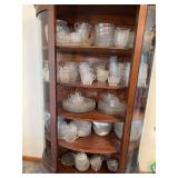 All EAPG glassware inside curved glass case