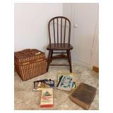 Picnic hamper, child size bent back chair and light reading books
