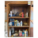 On shelf includes spray pants, Sta-Bil, miter saw, BenzOMatic propane bottles, 2 cycle oil, etc