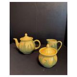 Shawnee cream, sugar and teapot, creamer top with hairlines and chip