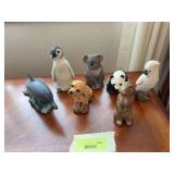 Seven Sandicast animal figurines